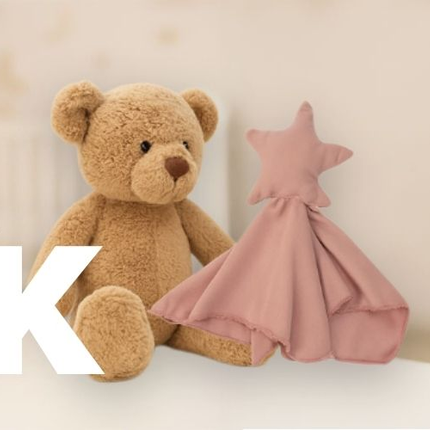 Banner de Amamantas anunciando Black Week con hasta 50% de descuento, mostrando un osito de peluche y una manta rosa.